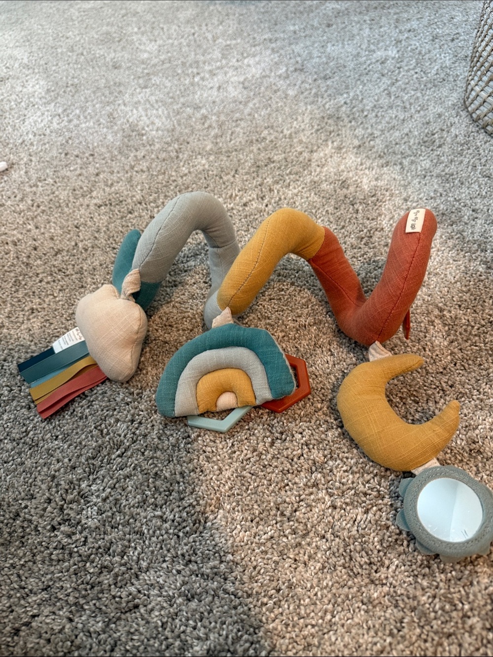 Itzy Ritzy Spiral Stroller Toy in Mustard, Teal, Rust, Cream